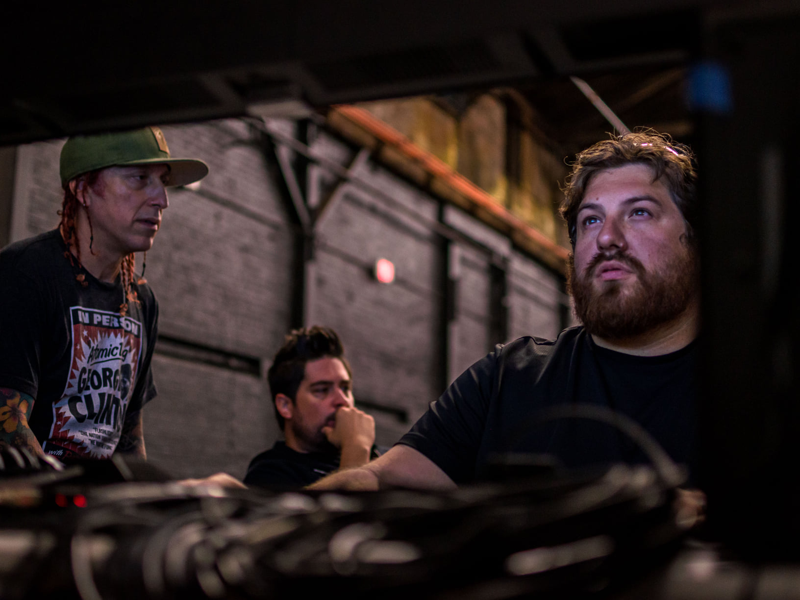 Collaborative songwriting discussion at Instamix Live studio